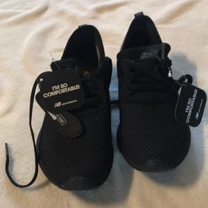 New Balance black athletic shoes